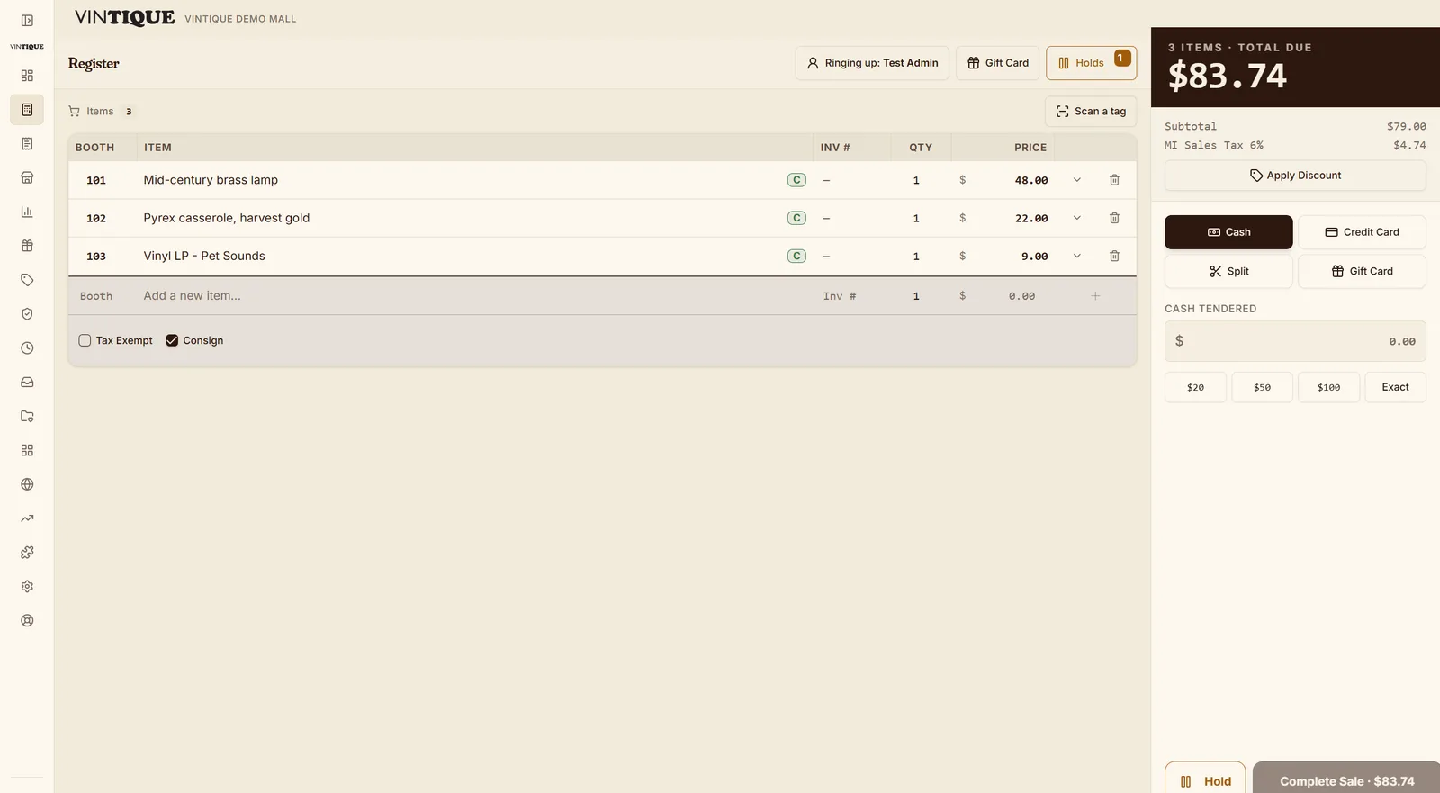 The Vintique register mid-sale: three items from three booths in one cart, cash tender selected.